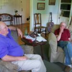 Two men sitting on a couch in the living room