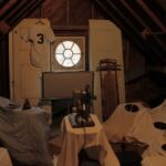 Set for the opening sequence for the film "I'll Knock a Homer for You" A room with many blankets and pillows on the floor