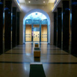 'I'll Knock a Homer for You' being screened at the Baseball Film Festival at National Baseball Hall of Fame (Cooperstown, NY) A hallway with many doors and windows in it